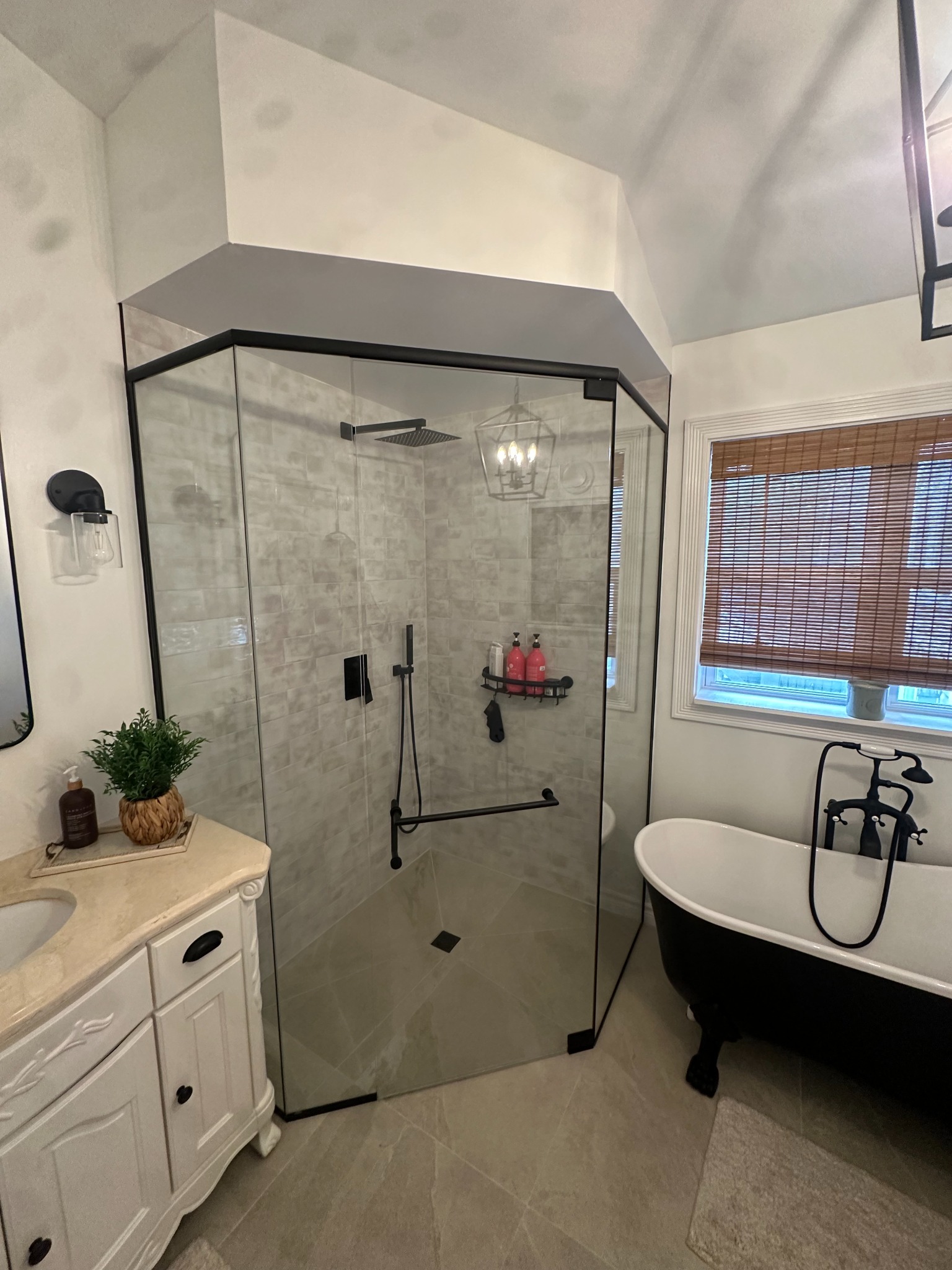 Custom shower enclosure with black framing and clear glass