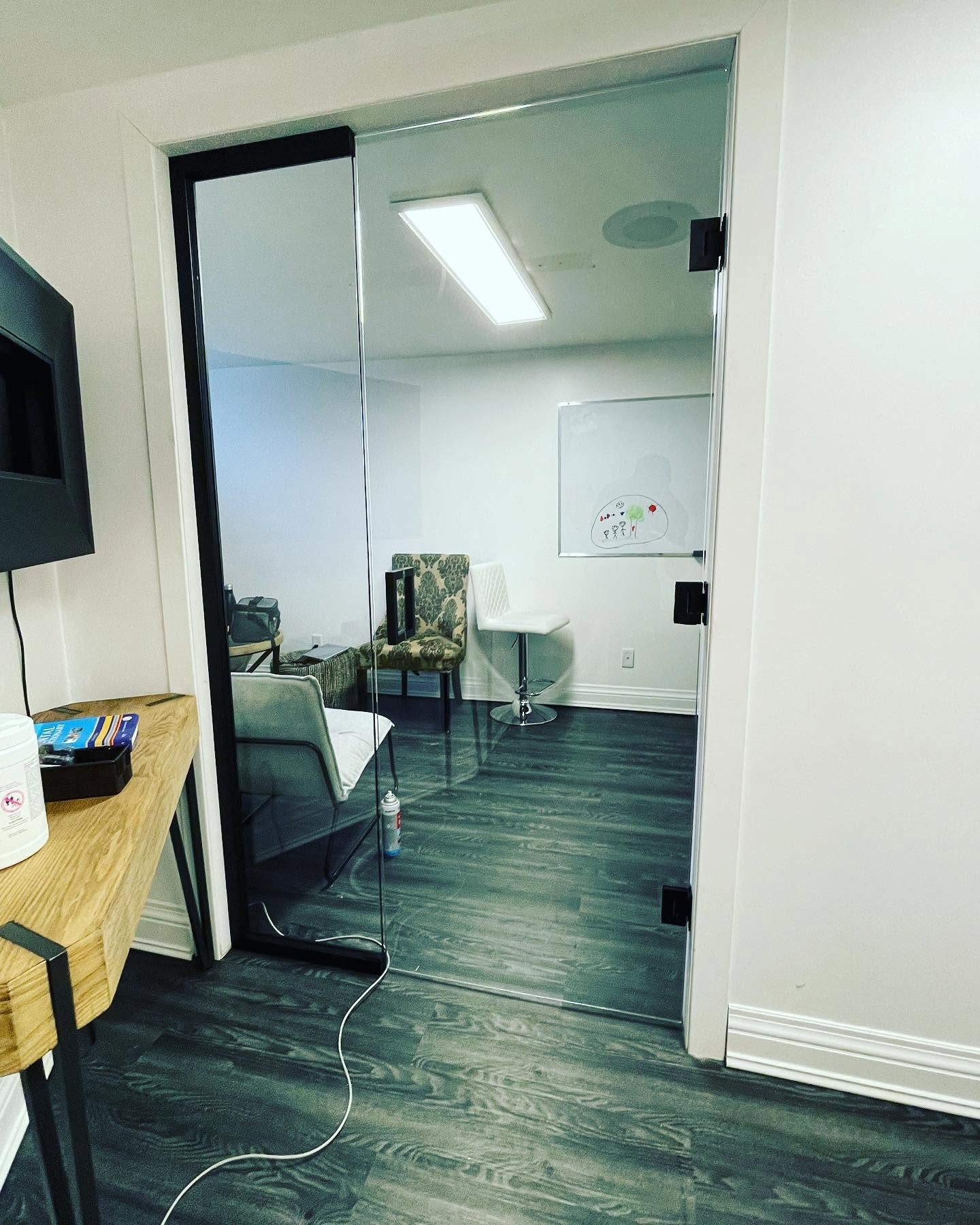 Clear commercial glass door with black hardware